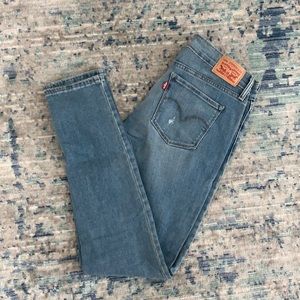 Levi’s 711 Skinny. Size 28. Medium Wash. Slightly Distressed. Like New.